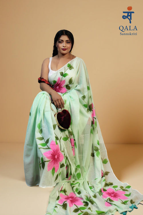 Pista green hand painted florals on mul cotton saree