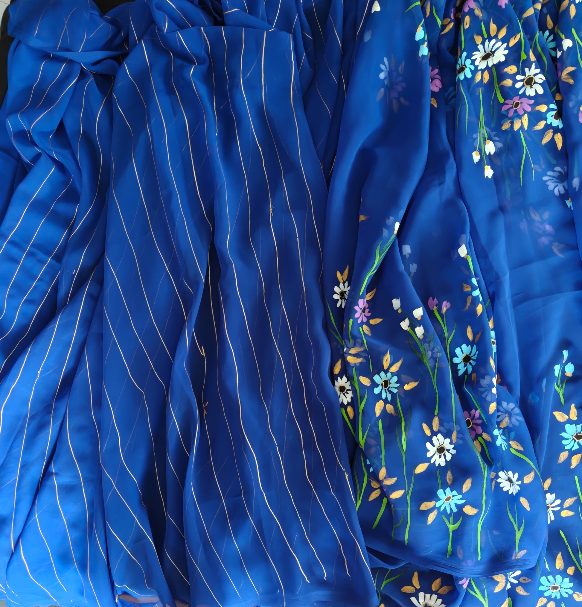 Blue floral georgette saree : Indraneeli Vasant