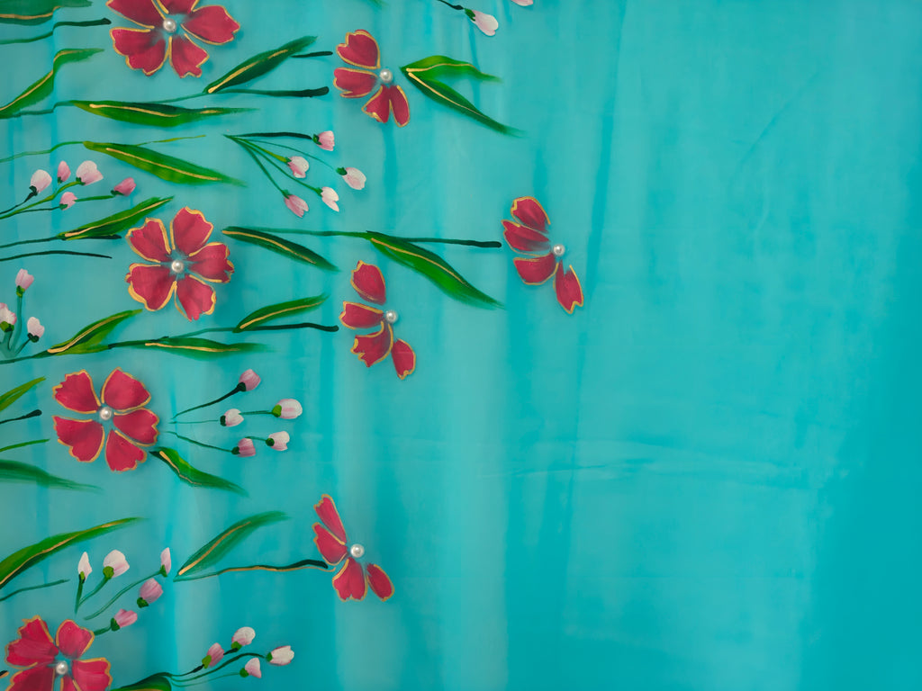 Light blue with coral red florals georgette saree : Gulnaar Baadal