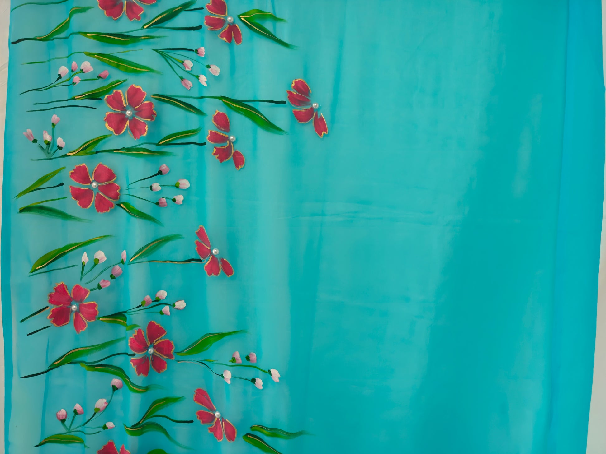 Light blue with coral red florals georgette saree : Gulnaar Baadal